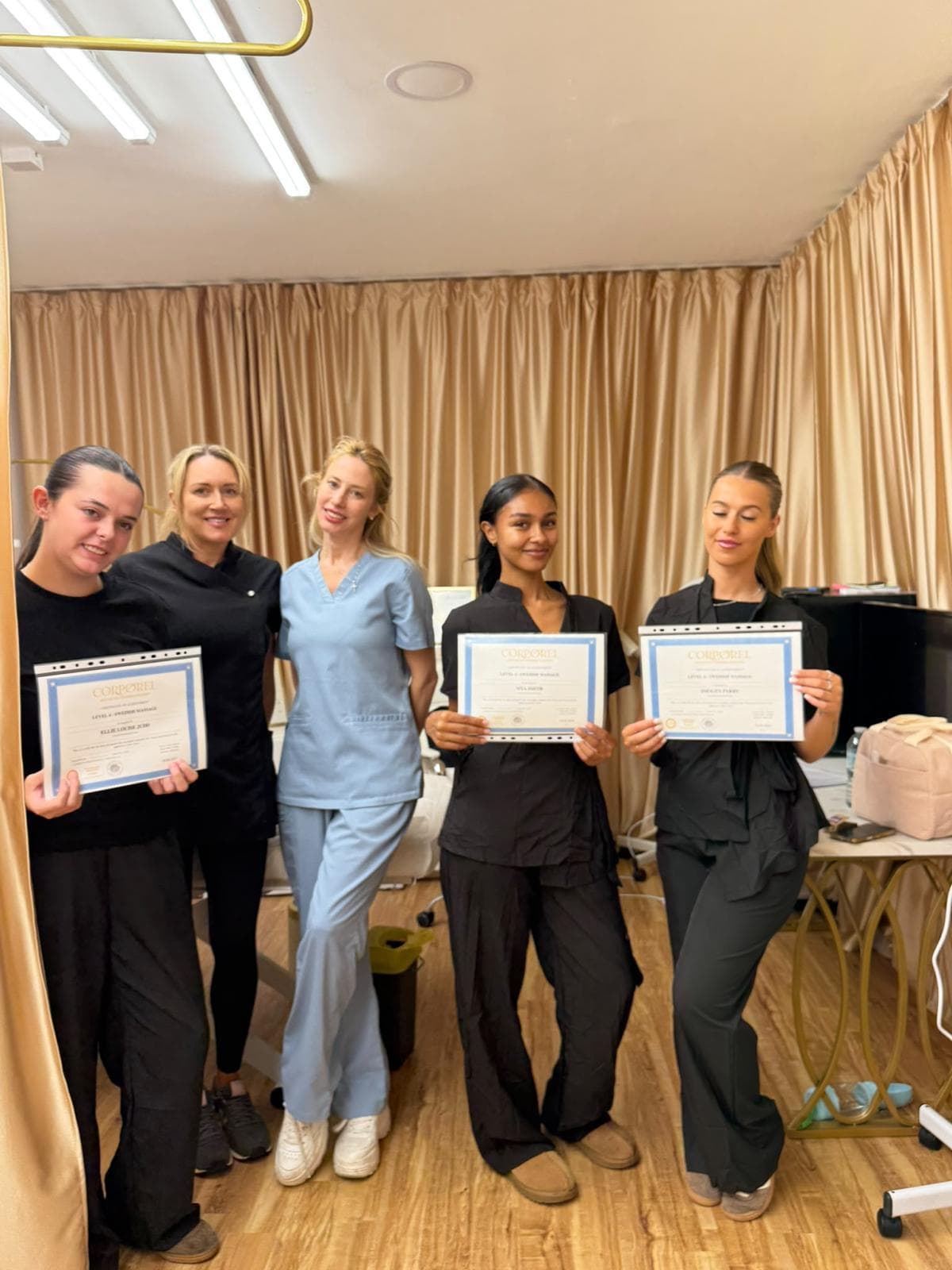 Lumière team with their Swedish massage training certificates